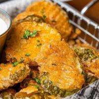 Fried Pickles · Flour and panko breaded krinkle cut pickles served with ranch dressing.