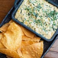 Spinach And Artichoke Dip · Chopped spinach, artichokes, cheddar jack, mozzarella, parmesan, and cream cheeses. served w...