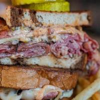 Bronson Reuben Sandwich · Piled high corned beef and pastrami, gruyere, sauerkraut, and thousand island dressing on ry...