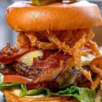 Pub Burger Sandwich · Grilled with fried onions, bacon, cheddar, lettuce, tomato, and roasted garlic aioli on a br...