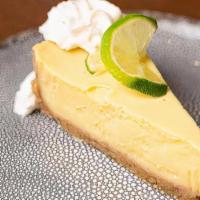 Key Lime Pie · Slice of pie with whipped cream.
