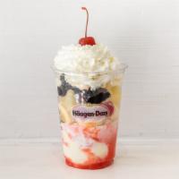 Banana Split Dazzler · 3 Scoops of vanilla ice cream, hot fudge, a sliced banana, strawberries and pineapples, topp...