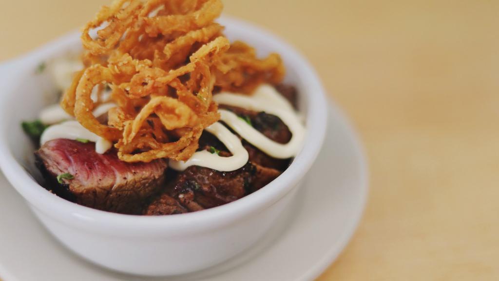 Steak Tips · Feather Bowler's Belgian Ale marinated Angus beef steak tips, topped with frizzled onions. Add extra sauce for an additional charge.