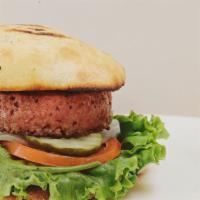 Vegetarian Beyond Burger · Vegetarian friendly. Plant-based patty (Beyond Burger) with lettuce, tomato, and onion serve...