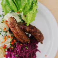 Belgian Sausage · Specially made for Cadieux Café, served with spinach mashed potatoes, and red cabbage