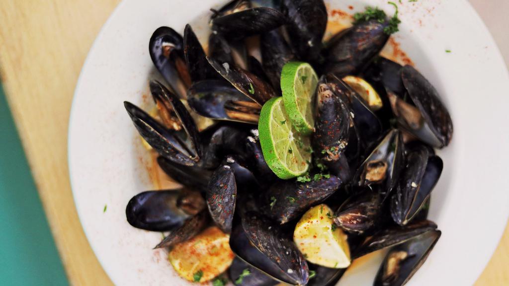 Thai Curry Mussels · Mussels steamed in coconut milk, curry paste, white wine, garlic and lime