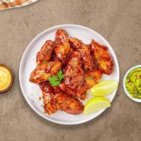 Honey Be My Bbq Wings · Fresh chicken wings breaded, fried until golden brown, and tossed in honey and barbecue sauc...