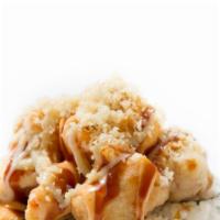 Volcano Roll · California roll topped with baked crawfish, eel sauce, spicy mayo, and crunch.