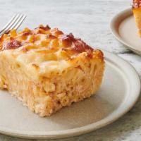 Macaroni Pie · Classic macaroni with melted cheddar cheese.