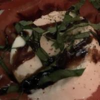 Caprese Salad. · Freshly sliced tomatoes with buffalo cheese, chopped basil, and our balsamic reduction dress...