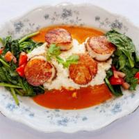 Seared Scallops · Served with risotto, sautéed spinach, and shrimp sauce.