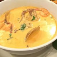 83- Mariscada · Seafood soup served with lobster, shrimp, clams, cream sauce, and corn tortillas.