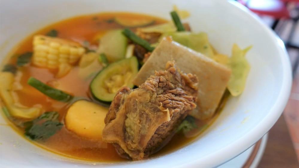 86- Sopa De Res · Homemade beef soup with vegetables.