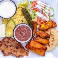 46- Plato Tipico Salvadoreno · Served with grilled steak, corn tamale, one pupusa, fried plantain, cheese, avocado, rice, f...