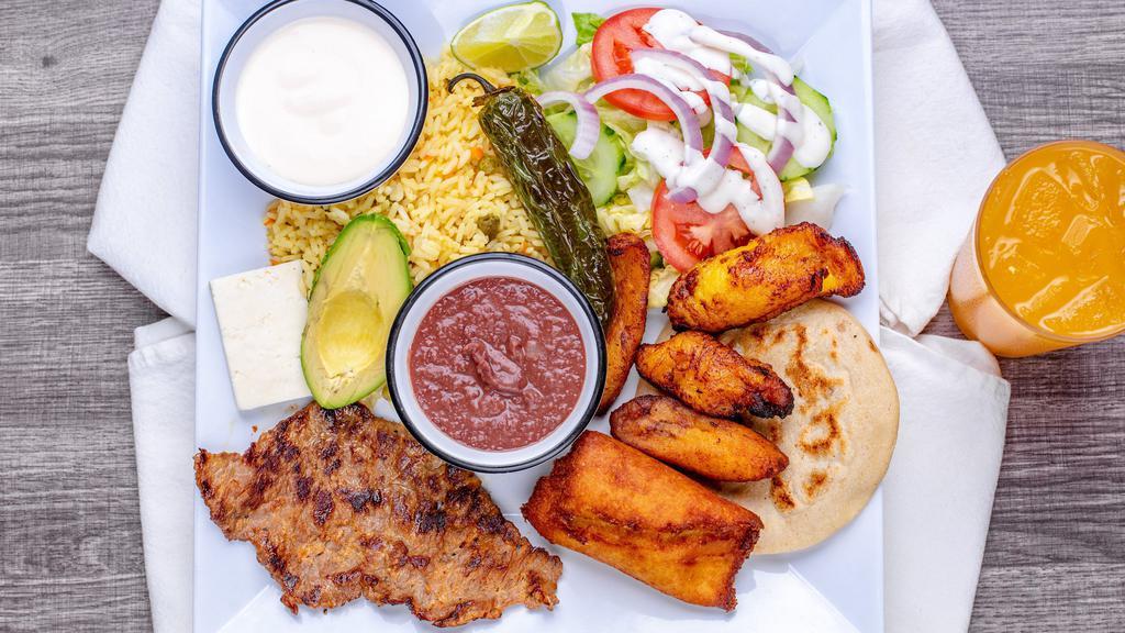 46- Plato Tipico Salvadoreno · Served with grilled steak, corn tamale, one pupusa, fried plantain, cheese, avocado, rice, fried beans & salad.