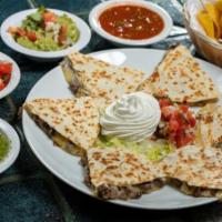 Quesadillas · Quesadilla (6 pieces)- Flour tortilla and melted cheese. Served with pico de gallo and sour ...