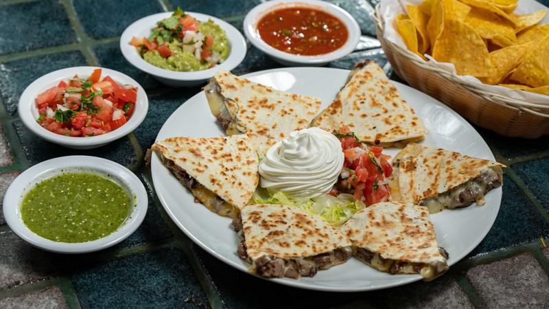 Quesadillas · Quesadilla (6 pieces)- Flour tortilla and melted cheese. Served with pico de gallo and sour cream.