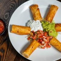 Rolled Chicken Taquitos · Rolled Chicken Taquitos (6 pieces)- Crispy flour tortillas rolled and stuffed with seasoned ...
