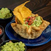 Guacamole Dip · Guacamole Dip- Ripe Hass avocado, onions, tomatoes, cilantro, and fresh lime. Served in a cr...