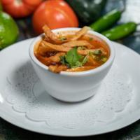 Chicken Tortilla Soup · Chicken Tortilla Soup- Chicken, fresh guacamole, vegetable broth, cheese, and crispy tortill...
