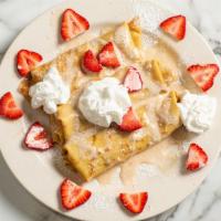 Strawberry Or Blueberry Pancake · with whipped cream