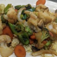 Veggie Stir-Fry · served over rice. With Chicken or Shrimp for an additional charge