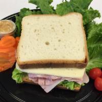 Virginia Baked Ham & Havarti - Sack Lunch · Artisan classic white bread, baked Virginia Ham, lettuce and Havarti cheese.
Comes with an i...