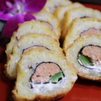 Caliente Roll · 8 Pieces- Spicy. Deep fried spicy tuna, scallions, masago, jalapeno topped with jalapeno may...