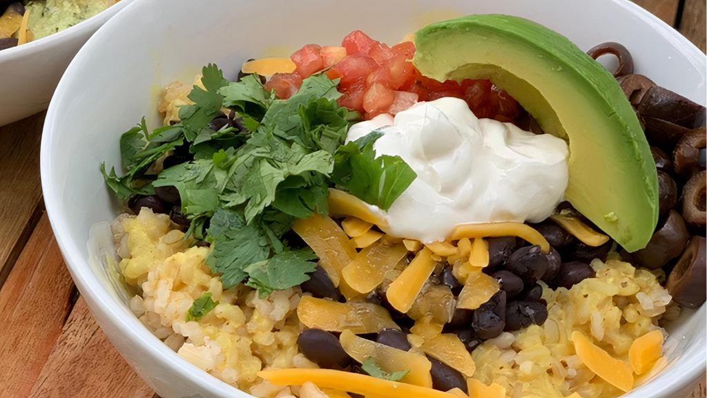 Mighty Bowl · Brown rice, black beans, cheddar, cheese, sour cream, avocado, salsa, cilantro, black olives with choice of sauce. V, GF, VO.