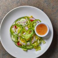 Garden Salad · A blend of fresh iceberg and romaine lettuces with sliced red onions, green peppers, cucumbe...