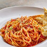 Spaghetti Marinara · Tossed in a homemade marinara sauce made with imported San marzano tomatoes and fresh basil.