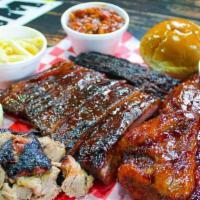 Family Meal Sampler · Serves 6-8 people. Includes: one pound of pork, one pound of brisket, one whole chicken, 1 r...