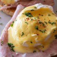 Eggs Benedict · Muffin egg ham and hollandaise sauce.