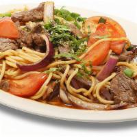 Tallarin Saltado Beef · Spaghetti served with beef, mixed with our secret sauce, chopped red onions and tomatoes  wi...