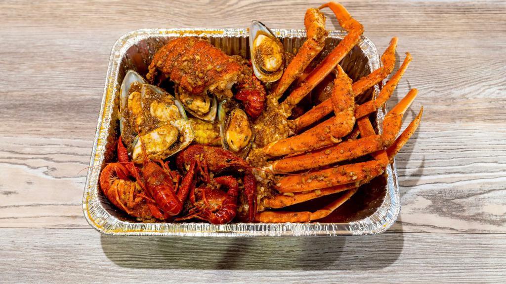 Combo  #6 · One lobster tail, one cluster snow crab leg, one pound headless shrimp, one pound crawfish, one pound green mussel, two corn, two potatoes and one sausage.