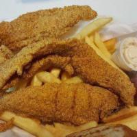 Catfish Basket With Fries · Fried catfish fillets with fries.