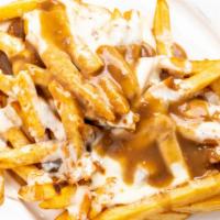 Disco Fries · French fries smothered in melted mozzarella and our homemade brown gravy.