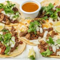 Chilangos · Five steak and chorizo tacos. Double-stacked corn tortillas with melted cheese in the middle...