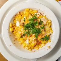 Esquites · Roasted street corn in a bowl, tossed in mayo-lime sauce with powdered chile, queso fresco a...