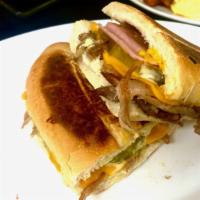 Cuban · two types of pork (ham and roast pork), Swiss cheese, yellow mustard, sliced pickles