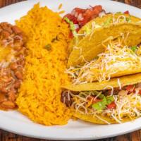 Tacos Al Carbon · Three soft fresh flour tortillas, filled with choice of meat. Served with Mexican rice, refr...