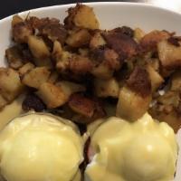 Benjamin · Two poached eggs with Canadian bacon on a toasted English muffin, topped with hollandaise sa...