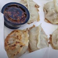 Authentic Chinese Dumplings (8) · Handmade and cooked to order. With homemade soy garlic sauce.