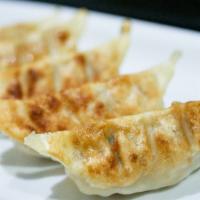 Gyoza · Pork and vegetable dumpling with house special sauce (pan-fried or steamed).