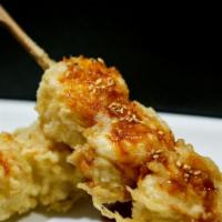 Tempura Shumai · Crispy tempura battered shrimp shumai topped with lightly spiced bean paste sauce.