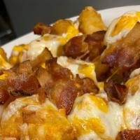 Loaded Tots · tots, bacon, cheddar cheese, sour cream, chives