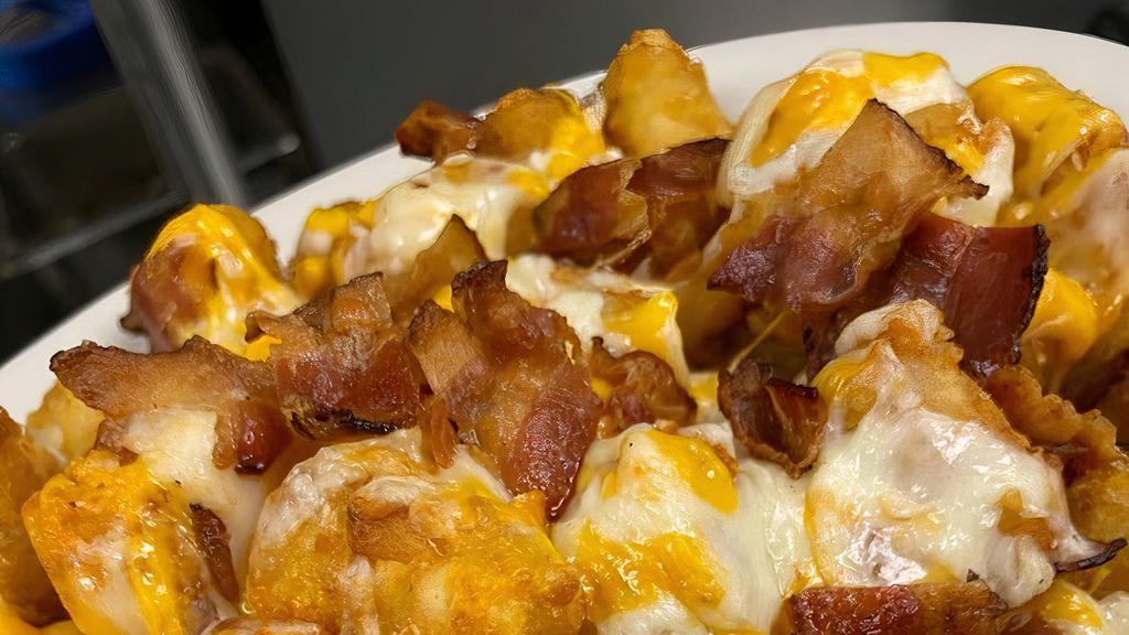 Loaded Tots · tots, bacon, cheddar cheese, sour cream, chives