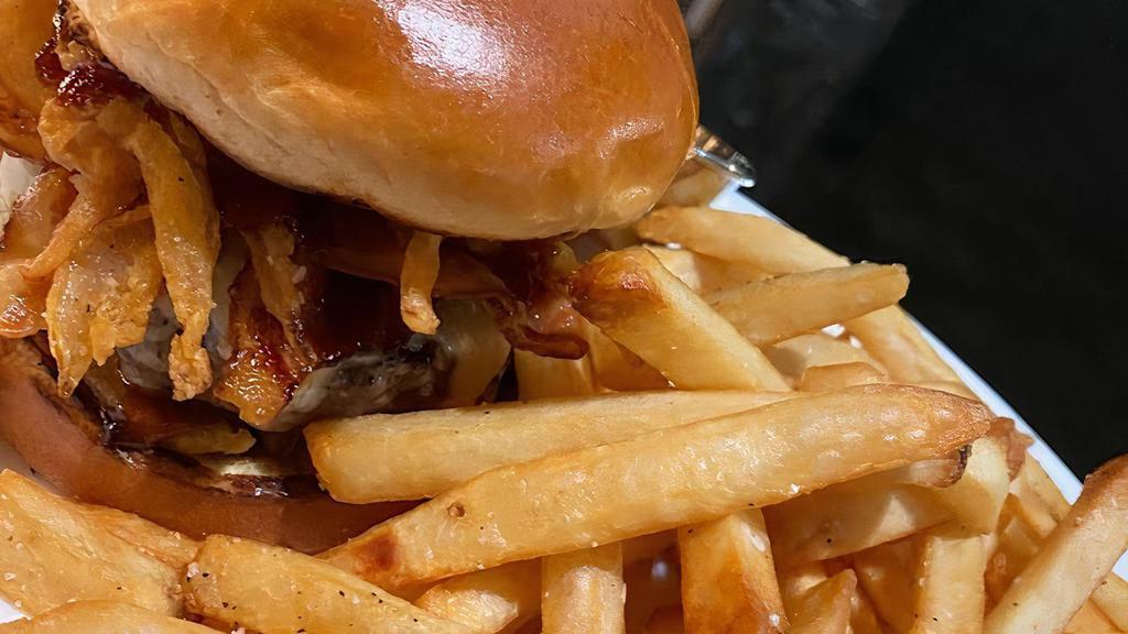 Rodeo Burger · 7oz, onion strings, bbq, bacon, pepperjack