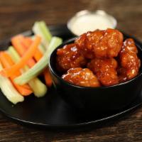 Boneless Hot Honey · 8 boneless wings tossed in hot honey (medium heat) and a dipping sauce of your choice