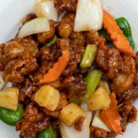 Sweet Sour Pork · Batter-fried pork served with sweet and sour sauce.